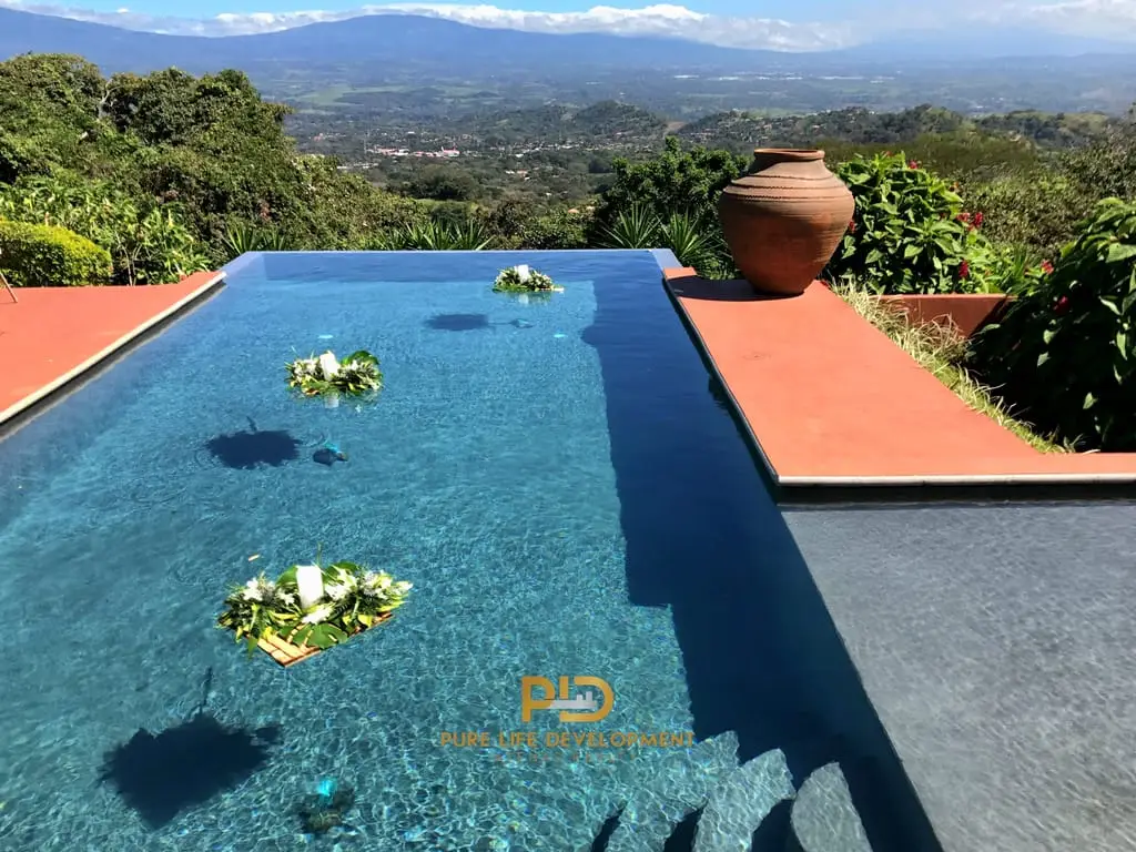 Infinity pool with mountain view and pottery