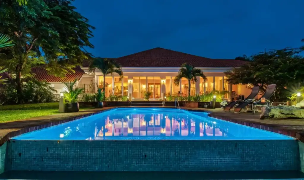 Luxurious villa with pool at night