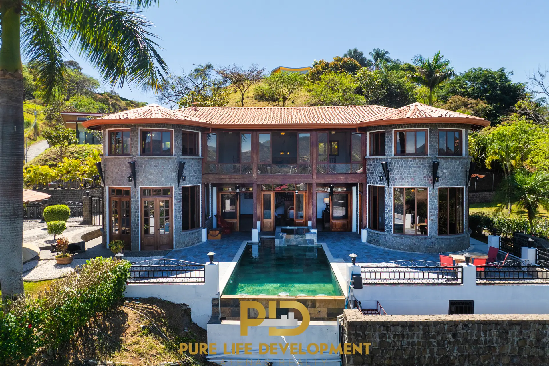 The exterior of a 5 bedroom old-world-style home in Castillo Atenas.