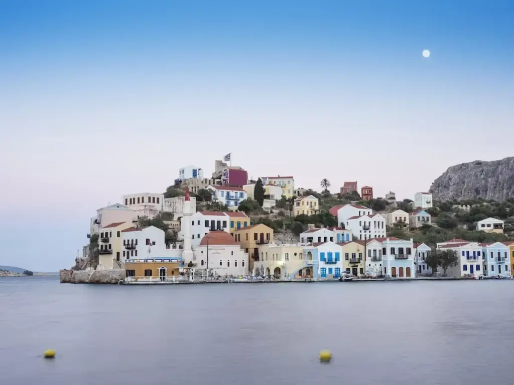 Scenic view of colorful coastal town at dusk.