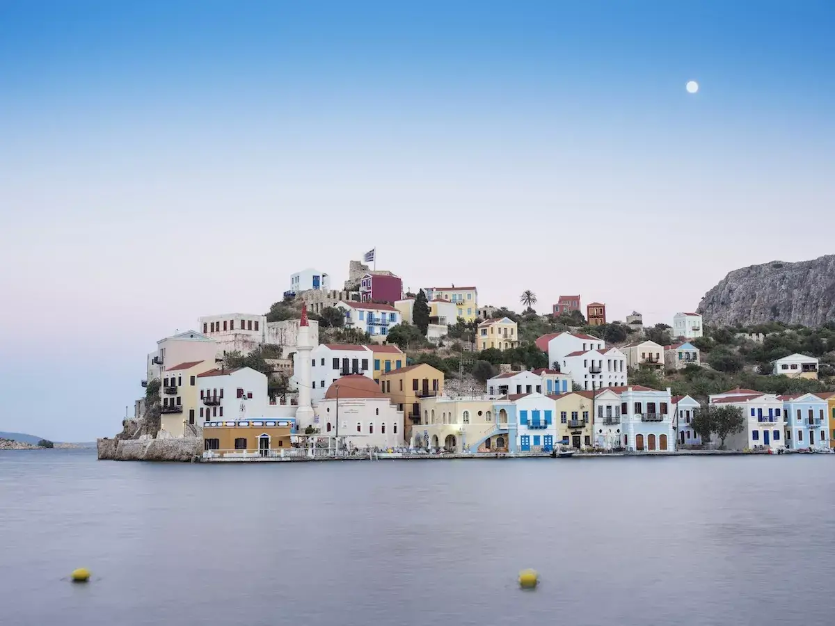 Scenic view of colorful coastal town at dusk.