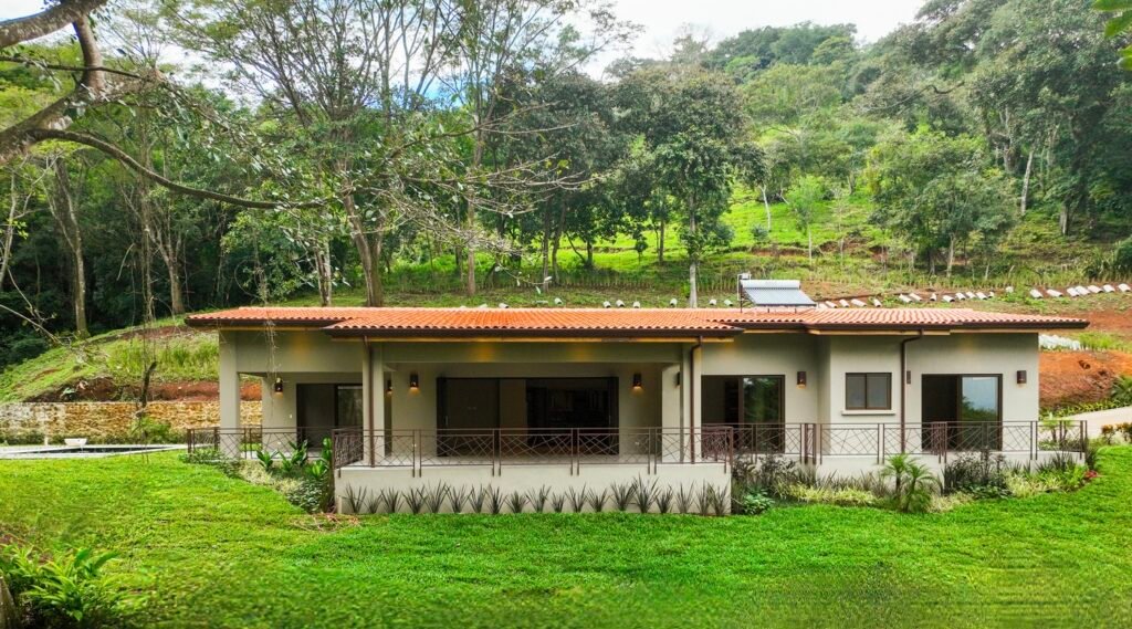 Modern house surrounded by lush greenery.
