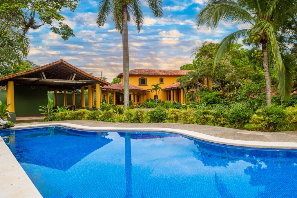 Tropical villa with pool and palm trees