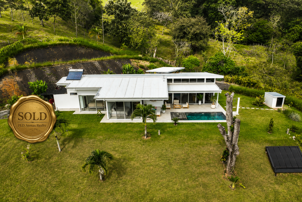 Modern hillside home with pool and solar panels