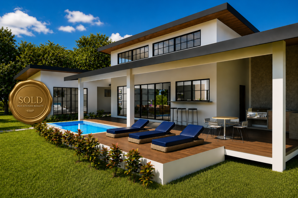 Modern luxury home with pool and sold sign