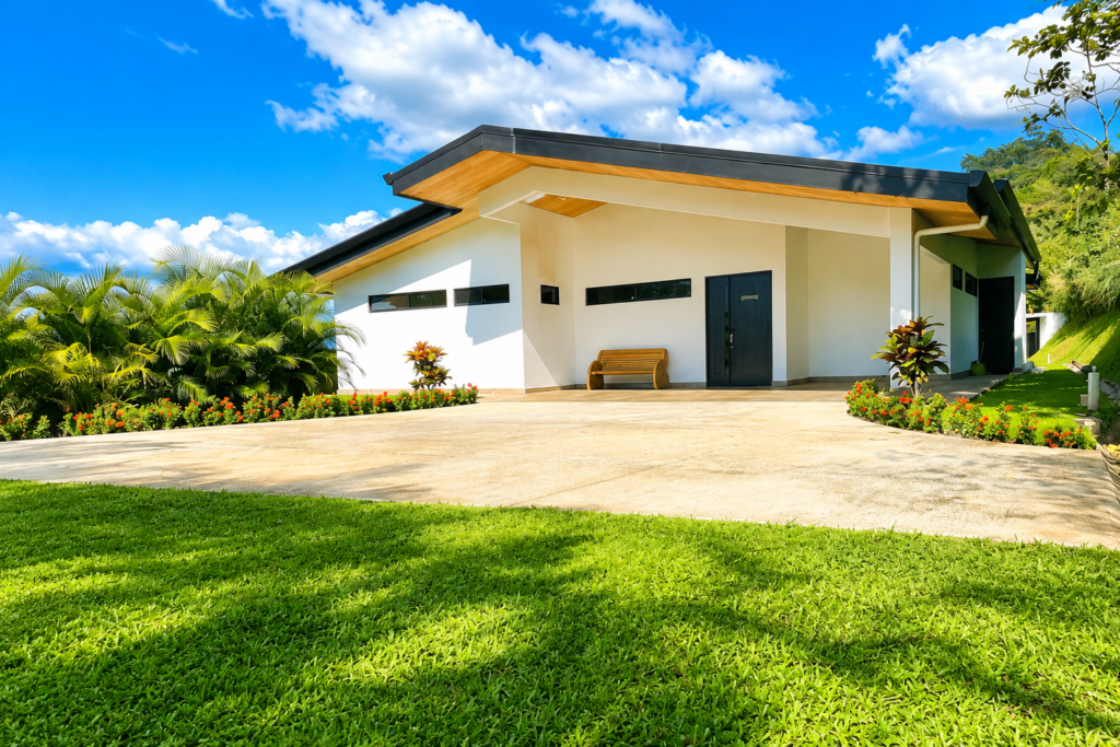Modern single-story home with tropical landscaping