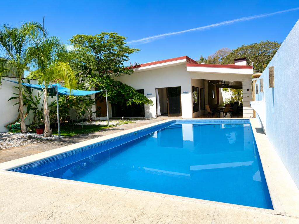 Modern home with backyard swimming pool and patio