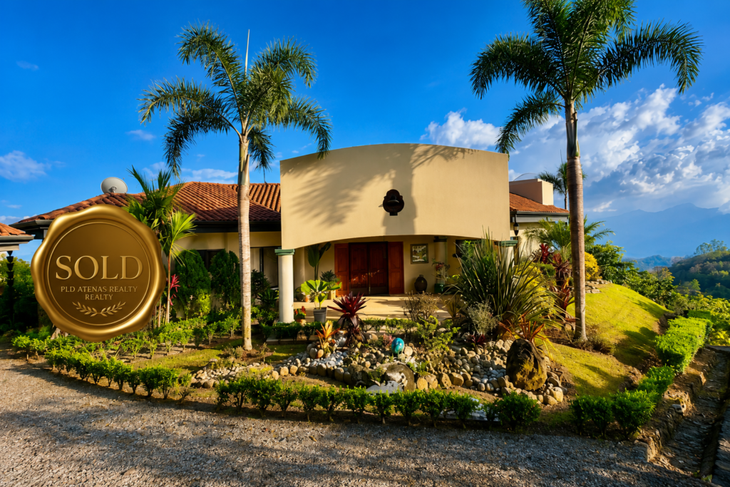 Luxury tropical home with Sold real estate badge
