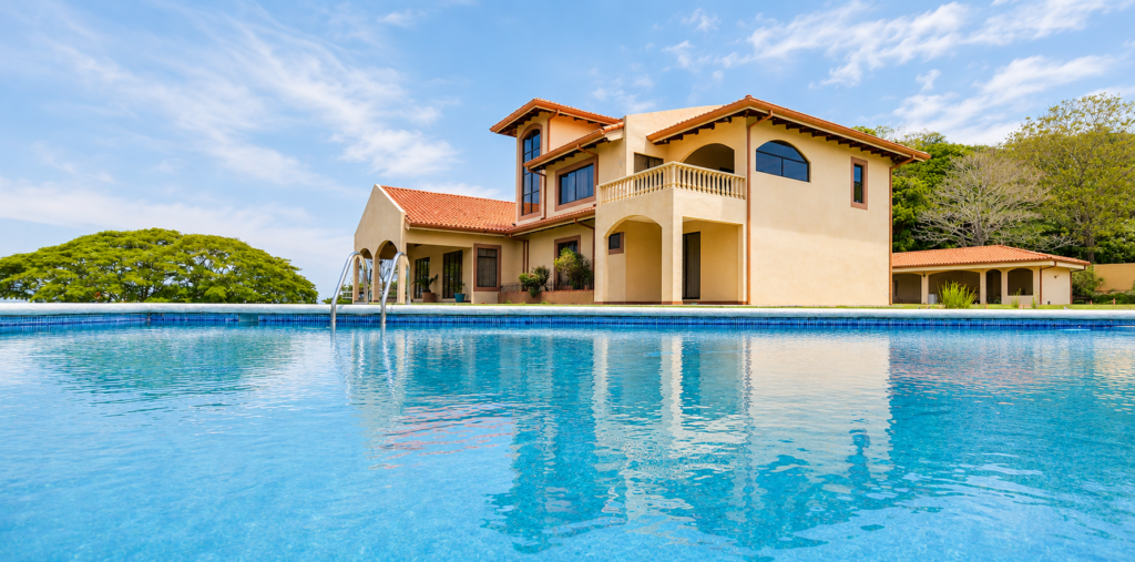 Mediterranean villa with pool under blue sky