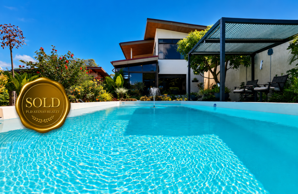 Modern home with pool and sold badge