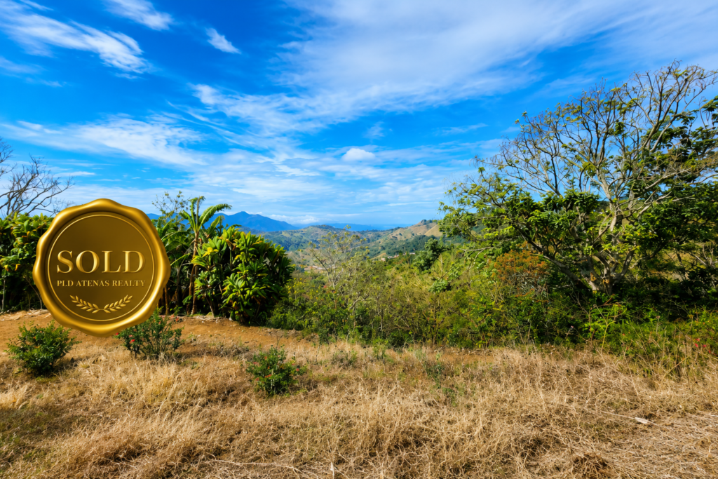 Mountain landscape with Sold realty seal overlay