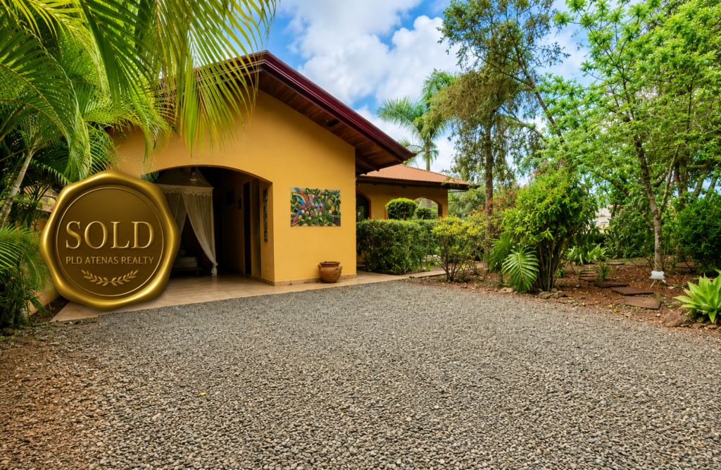Tropical home with sold real estate badge