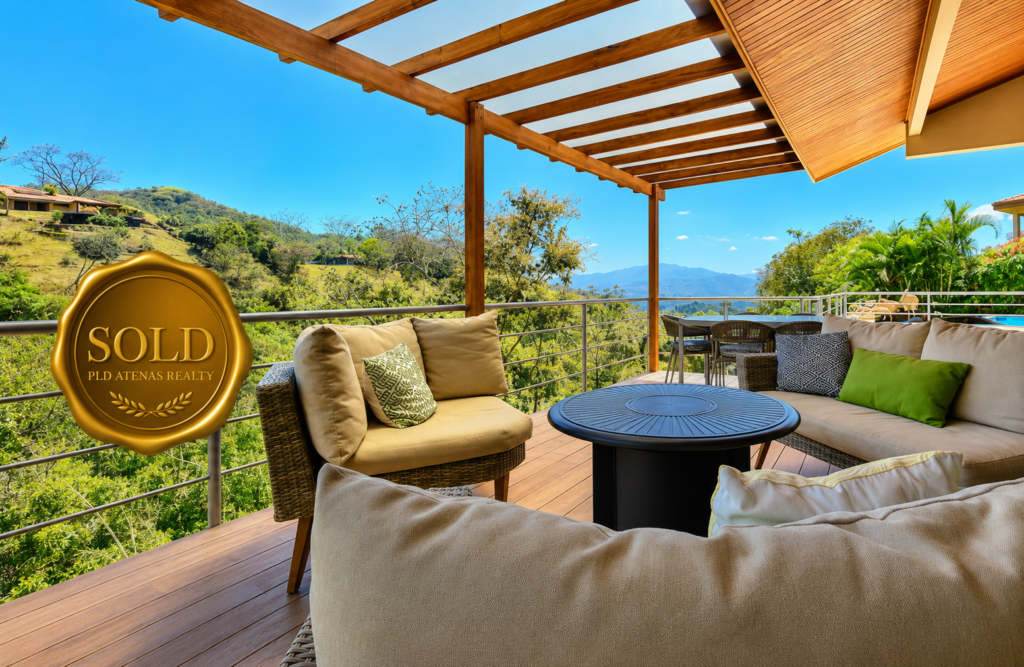 Covered terrace with mountain view and sold badge