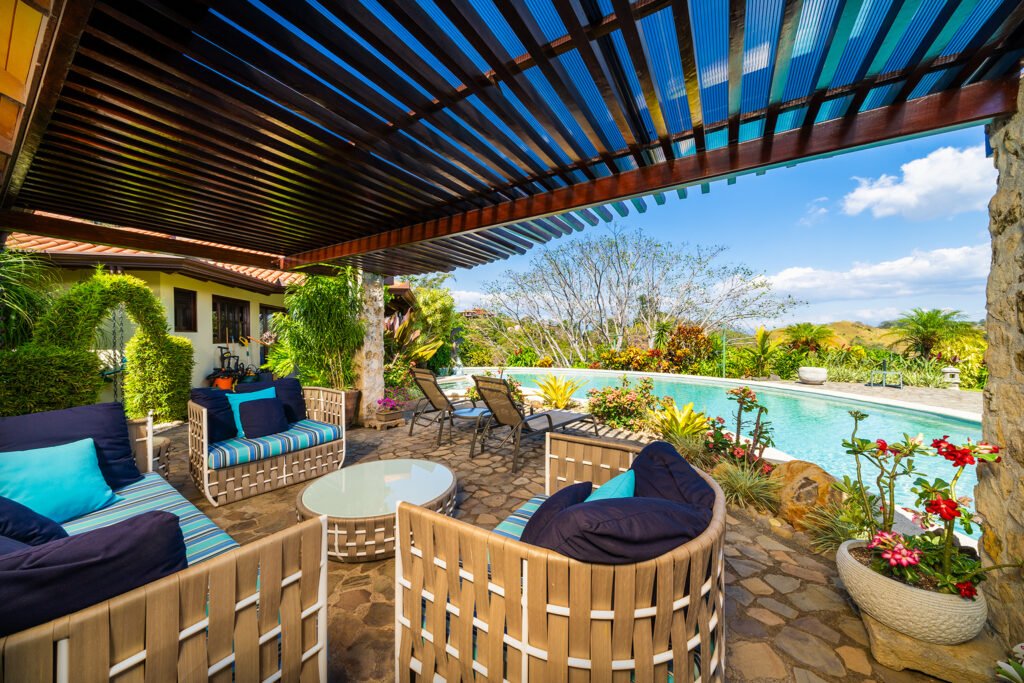 Luxury patio with pool and tropical landscaping