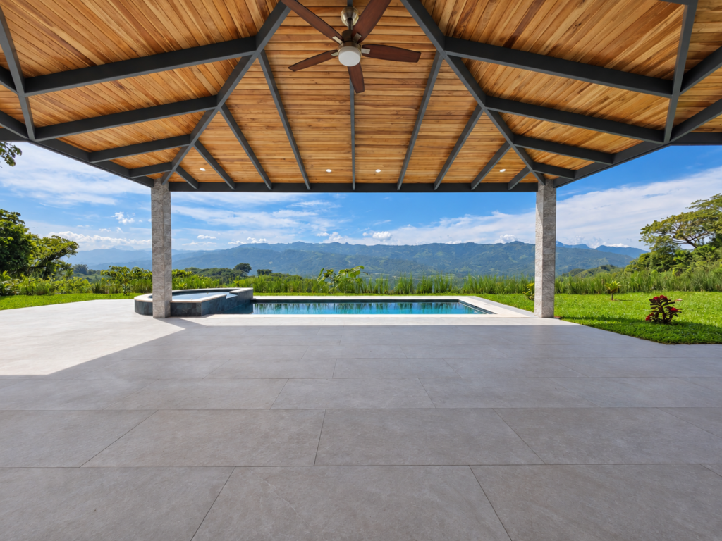 Covered patio overlooking pool and mountain landscape
