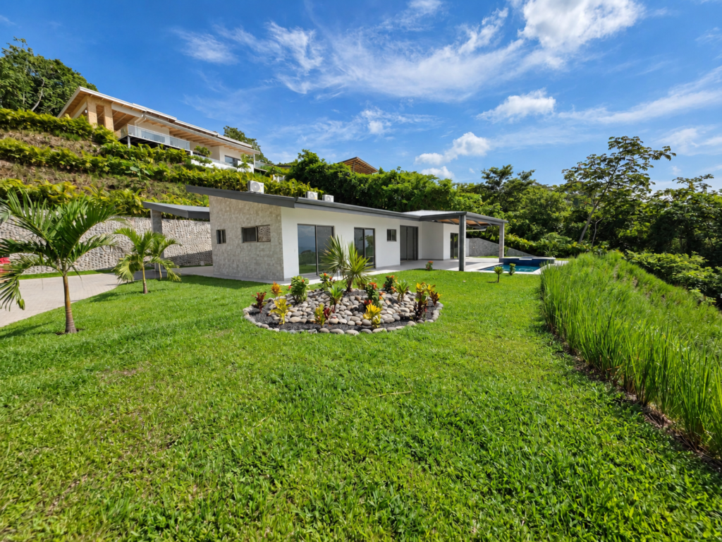 Modern tropical villa with lush garden and pool