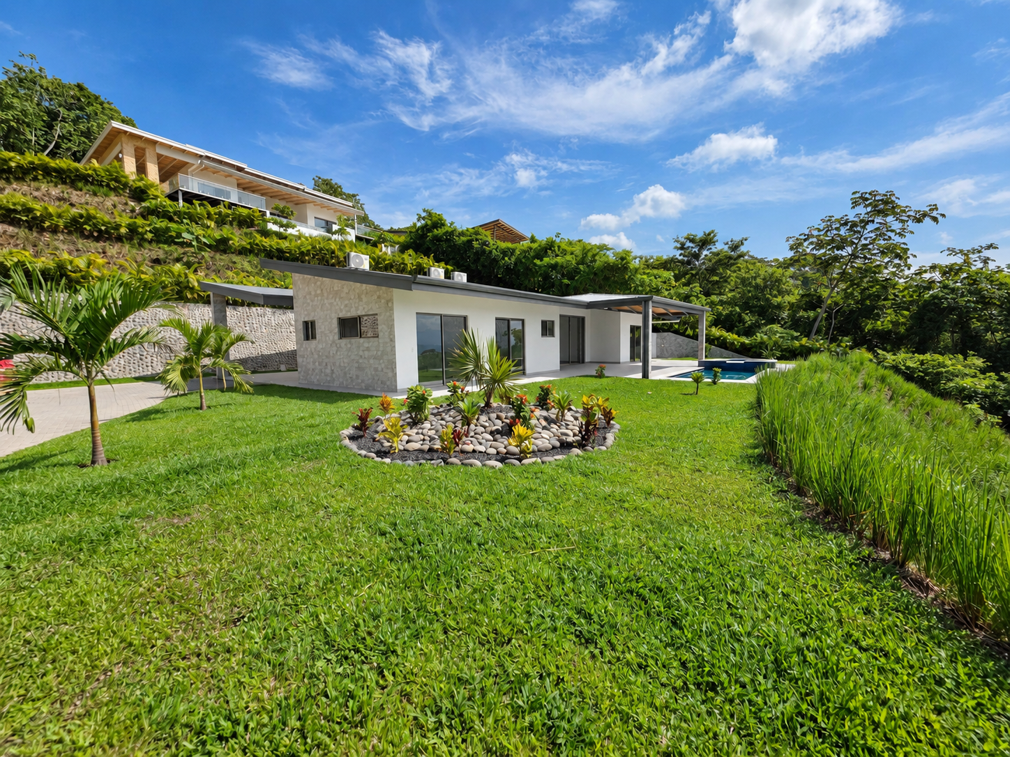 Modern tropical villa with lush garden and pool
